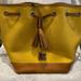 Dooney & Bourke Bags | Dooney & Bourke Pebble Grain Drawstring Shoulder Bag | Color: Brown/Yellow | Size: Os