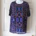 Lularoe Tops | Lularoe Irma Tunic Xxs Nwot $36 Oversized Black With Purple Orange Print High Lo | Color: Black/Purple | Size: Xxs