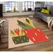 Tan/Green;tan Rectangle 5'3" x 7'7" Area Rug - East Urban Home Rectangle Devizes Machine Made Power Loom Area Rug in Tan/Green 91.0 x 63.0 x 0.16 in green/orange/pink/red | Wayfair