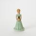 enesco Growing Up Figurine Porcelain/Ceramic in Green/Yellow | 5.5 H x 2.75 W x 2.75 D in | Wayfair E2311