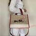 Coach Bags | Coach Ce645 Lunar New Year Dempsey Carryall In Signature Canvas Rabbit Carriage | Color: Cream/Tan | Size: Medium