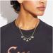 Coach Jewelry | Coach Signature Logo 12-K Gold Plated Brass With Crystals Charm Necklace | Color: Gold | Size: Os