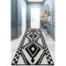 Black/White 118 x 31 x 0.39 in Area Rug - East Urban Home Swaffham Geometric Machine Made Power Loomed Area Rug in | Wayfair