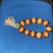 Free People Jewelry | Boho, Old (Vintage Possibly) Wooden Beads Stretch Bracelet With Tassel | Color: Brown/Tan | Size: Os