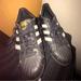 Adidas Shoes | Adidas Superstar Men's Casual Shoes Athletic Black & Gold Sneakers | Color: Black/Gold | Size: 7.5