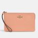 Coach Bags | Coach Large Corner Wristlet In Gold/Faded Blush | Color: Gold/Orange | Size: 7 3/4” L X 4 3/4” H X 1/2” W