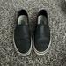 Vans Shoes | Black Vans Sneakers No Laces Pull In Shoes Hood Condition; Used Size 7 Us | Color: Black | Size: 7