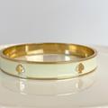 Kate Spade Jewelry | Kate Spade Bangle Bracelet Off White Enamel Yellow Gold Plate Designer Logo | Color: Gold/White | Size: 2.5”