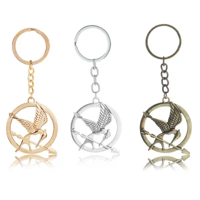 The Hunger Games Schlüsselanhänger, beliebter Vintage-Stil, Vögel-Charm, goldener Schnatz, Anhänger, Schlüsselanhänger, Schlüsselanhänger, Metall-Schlüsselanhänger, Autohalter Image