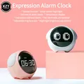 2022 New Cute Expression Alarm Clock Child Multifunctional Bedside Voice Control Night Light Snooze