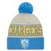 Men's New Era Powder Cream/Blue Los Angeles Chargers 2023 Sideline Historic Pom Cuffed Knit Hat