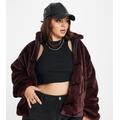 Nike Plus all over swoosh faux fur jacket in burgundy crush and black