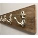 Bay Isle Home™ Solid Wood 4 - Hook Wall Mounted Coat Rack Wood/Metal in Brown | 6 H x 26 W x 2.5 D in | Wayfair C3B1B28CCECA4A249679B40CF78539C8