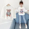 T-shirt manica lunga primavera autunno per ragazze 2024 moda stile coreano adolescenti ragazze top