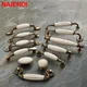 NAIERDI Maniglie per mobili in ceramica bianca bronzo antico in lega di zinco Manopole per cassetti Maniglia per porta dell'armadio Ferramenta per mobili europei