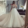LORIE – robe de mariée ligne A manches longues col haut dentelle appliquée 2023