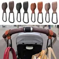 1/2pcs portatile in pelle PU passeggino gancio appendiabiti Velcros carrozzina gancio moschettone carrello organizzatore Clip per accessori passeggino