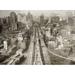 Brooklyn Bridge C1910. /Nbird S Eye View Of New York City With People Crossing The Brooklyn Bridge In The Foreground New York. Photograph