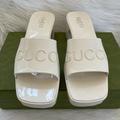 Gucci Shoes | Gucci Plastique Logo Embossed Rubber Jelly Mules White Platform Slide Sandal 40 | Color: White | Size: 10