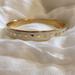 Kate Spade Jewelry | Gently Worn Kate Spade “Penny For Your Thoughts” Bangle. | Color: Cream/Gold | Size: Os