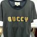 Gucci Tops | Gucci Black And Gold Unisex Tee Pre Loved | Color: Black/Gold | Size: L