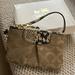 Coach Accessories | Coach Wristlet With Original Box. Has Signature "C" In Fabric Pattern. | Color: Brown/Tan | Size: Os