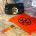 Tory Burch Bags | Black Leather Tory Burch Clutch. 2 Zippered Pockets. Beautiful Emblem. | Color: Black | Size: Os