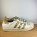 Adidas Shoes | Adidas Superstar Shell Toe Sneakers Women’s Size 7.5 White/Gold | Color: Gold/White | Size: 7.5