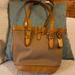 Dooney & Bourke Bags | Dooney & Bourke Vintage Cabriolet Bucket Bag Good Shape Some Marking On Leather | Color: Tan | Size: Os