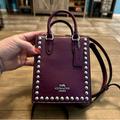 Coach Bags | Coach Pebbled Leather North South Mini Crossbody Tote Bag Purse With Rivets | Color: Pink/Silver | Size: Measures: 5 1/2" (L) X 6 3/4" (H) X 2" (W)