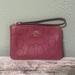 Coach Bags | Coach Raspberry Perforated C’s Wristlet | Color: Pink/Red | Size: Os