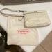 Coach Bags | Coach Perforated Signature Wristlet | Color: Silver/White | Size: Os