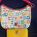 Dooney & Bourke Bags | Dooney&Bourke Purse And Matching Wallet | Color: White/Yellow | Size: Os