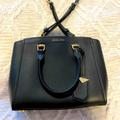 Michael Kors Bags | Michael Kors Black Handbag. Shoulder Strap Or Handles. Black Leather With Gold | Color: Black | Size: Os