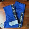 Nike Pants & Jumpsuits | Nike Royal Blue Dri Fit Logo Glitter Leggings | Color: Blue/Silver | Size: Xs