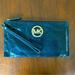 Michael Kors Bags | Michael Kors Fulton Clutch | Color: Black/Gold | Size: Os