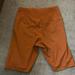 Nike Shorts | Nike One Luxe Icon Clash Mid Rise Athletic Biker Shorts Orange Dri Fit | Color: Orange | Size: Xs