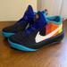 Nike Shoes | Nike Team Hustle D10 Space Jam 'Tune Squad' Youth Athletic Shoes, Size 4.5y | Color: Black/Blue | Size: 4.5b