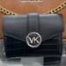 Michael Kors Bags | Michael Kors Carmen Medium Logo And Faux Leather Wallet Black Nwt | Color: Black/Silver | Size: Medium