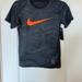 Nike Shirts & Tops | Boys Medium Nike Shirt. Black Base With White Dash Marks And Orange Nike Swish | Color: Black | Size: Mb