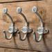 CTW Home Collection Distressed Metal Numbered Wall Hooks Set of 3 7 inch Height