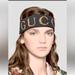 Gucci Accessories | Gucci Black Spandex Gold Signature Logo Headband Unisex | Color: Black/Gold | Size: Os