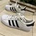 Adidas Shoes | Adidas Superstar Sneakers Leather Size 7 Shell Toe White Black Gold | Color: Black/White | Size: 7