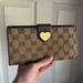 Gucci Bags | Gucci Monogram Heart Continental Long Wallet Monogram Brown Cloth/Leather | Color: Brown/Tan | Size: Os