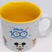 Disney Dining | Disney 100 Years Of Wonder Coffee Mug Mickey Snow White Coco Daffy Duck Bambi | Color: Gold/White | Size: Os