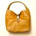 Dooney & Bourke Bags | Dooney & Bourke Women's Pebble Leather Logo Lock Hobo | Color: Tan | Size: Os