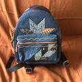 Coach Bags | Coach Mini Charlie Star Patch Blue Denim/Leather Backpack | Color: Blue/Red | Size: Os