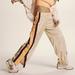 Free People Pants & Jumpsuits | Free People Movement End Zone Track Pants Women's Size Medium | Color: Cream/Orange | Size: M