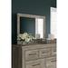 Signature Design by Ashley Yarbeck Sand Bedroom Mirror - 42"W x 2"D x 31"H