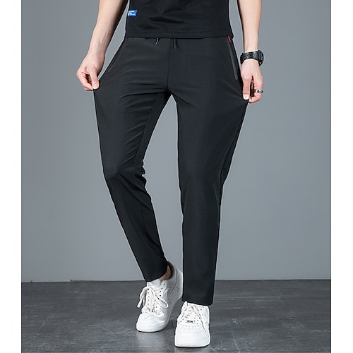 Herren Hose Hosen Freizeithose Stretchhose Kordelzug Elastische Taille Tasche mit Reißverschluss Feste Farbe Schnelltrocknend Täglich Strassenmode Klassisch Casual / sportlich Schwarz Blau Image